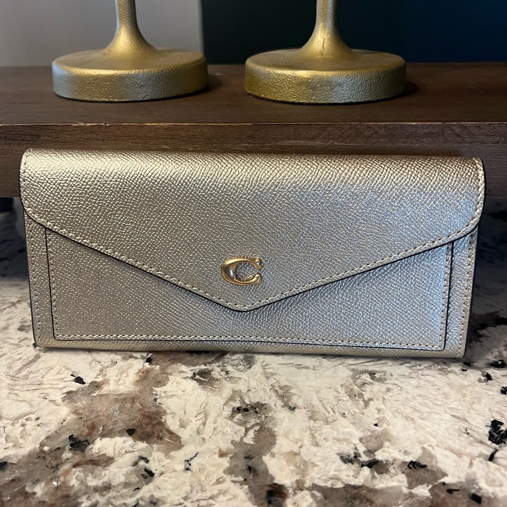 Coach Slim envelope style wallet in rare metallic Gold! New with tag detached ⭐️